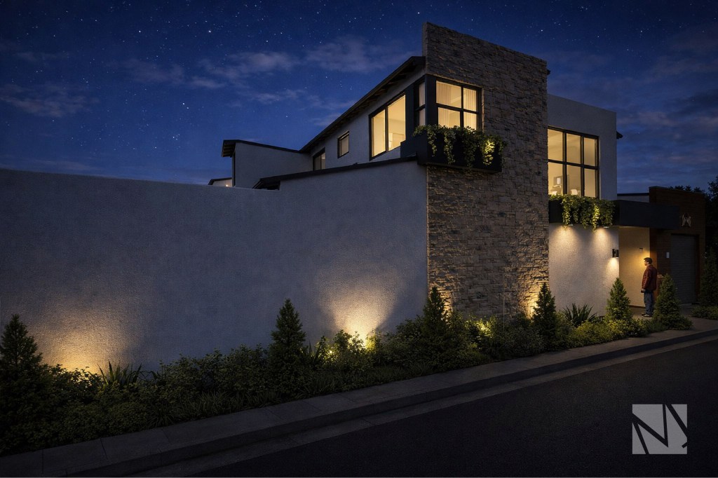 Vista nocturna de casa remodelada en Santa Elena con iluminación exterior y arquitectura contemporánea.